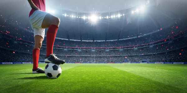 Papier peint Footballeur sur gazon